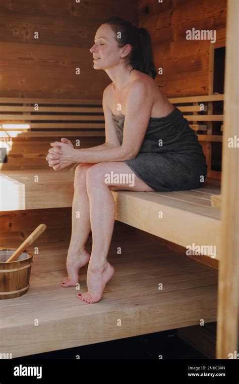 Woman Sitting In Finnish Sauna Stock Photo Alamy