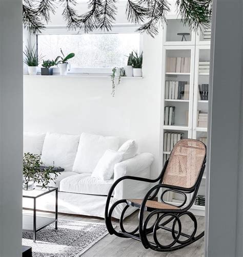 A Living Room Filled With Furniture And Plants