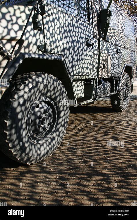 truck in camouflage military army base tent at open day Stock Photo - Alamy