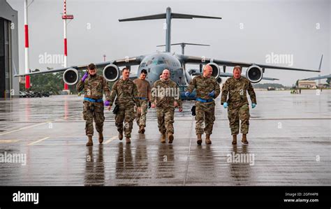 Us Air Force Airmen Assigned To The 721st Aerial Port Squadron Walk