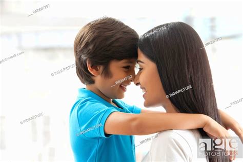 Smiling Mother And Son Touching Foreheads Stock Photo Picture And