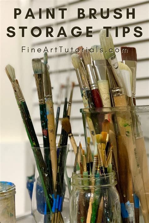 there are many brushes and paints in the glass jar on the table next to each other