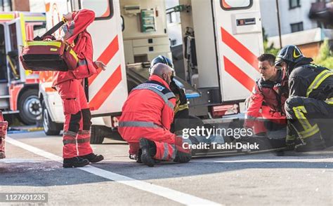 Firefighters Helping Rescue Team High-Res Stock Photo - Getty Images