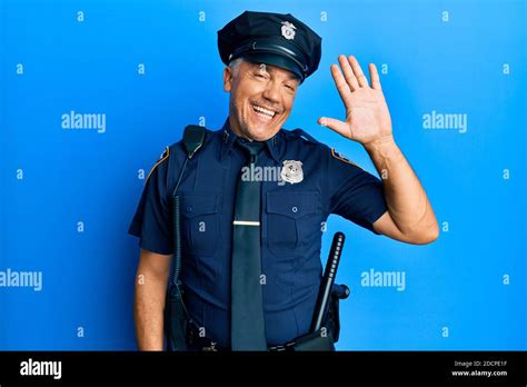 Handsome Middle Age Mature Man Wearing Police Uniform Waiving Saying Hello Happy And Smiling