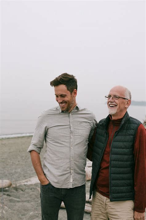 Mature Father And Son Hanging Out And Enjoying Each Other At The Beach By Stocksy Contributor