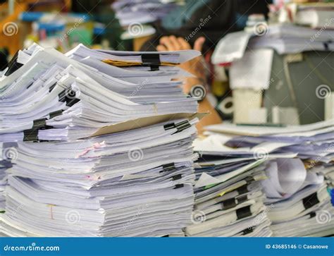 Pile Of Documents On Desk Stack Up High Waiting To Be Managed Stock