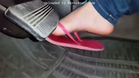 Amateur Girl In Flip Flops Pumping A Gas Pedal In The Car