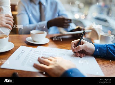 Signing business agreement Stock Photo - Alamy