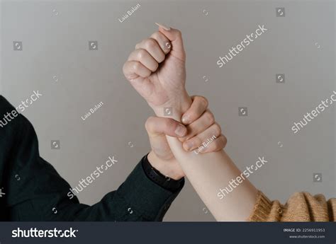 Hand Grabbing Arm