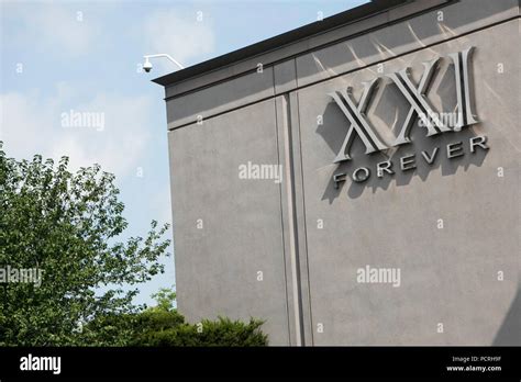 A Logo Sign Outside Of A Forever 21 XXI Forever Retail Store In