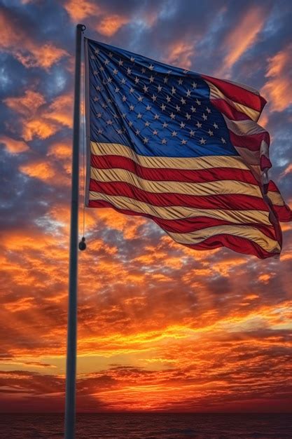 Premium Ai Image American Flag Waving Against A Sunset Backdrop