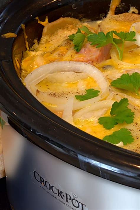 Crockpot Full Of Scalloped Potatoes And Ham And Cheese Scalloped