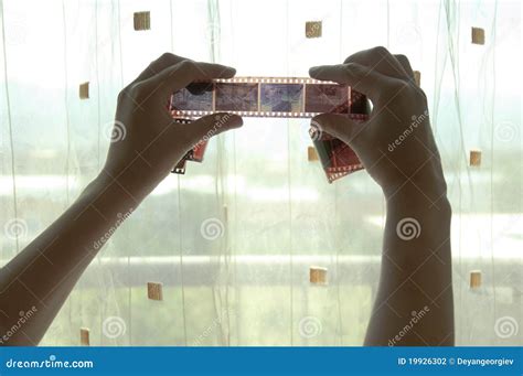 Two hands with photo film stock photo. Image of hands - 19926302