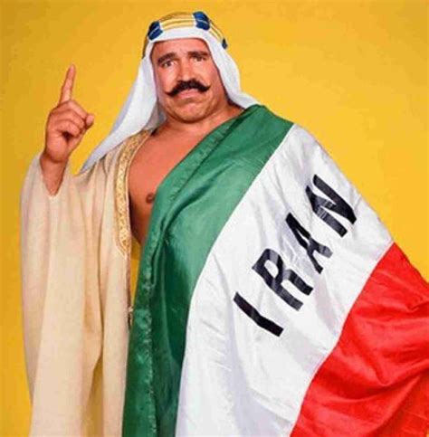 Download The Iron Sheik With Flag Wallpaper