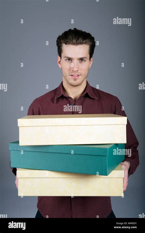 Young Man Holding Boxes Stock Photo Alamy