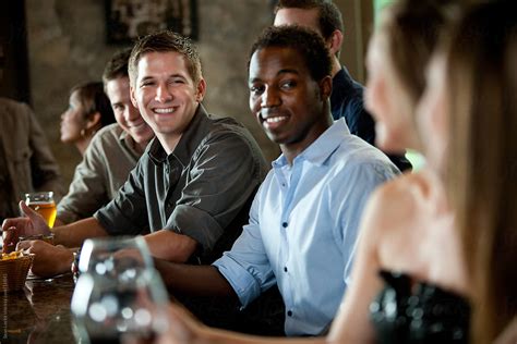 Bar Man Flirting With Woman By Stocksy Contributor Sean Locke