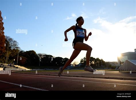 Japanese Athlete Running On Track Stock Photo Alamy