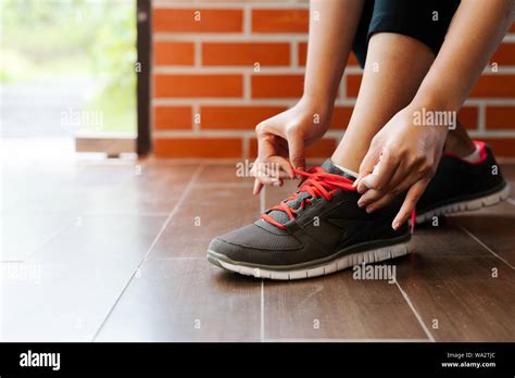 Sport Woman Tying Shoelace Before Running Outdoor Activities Stock