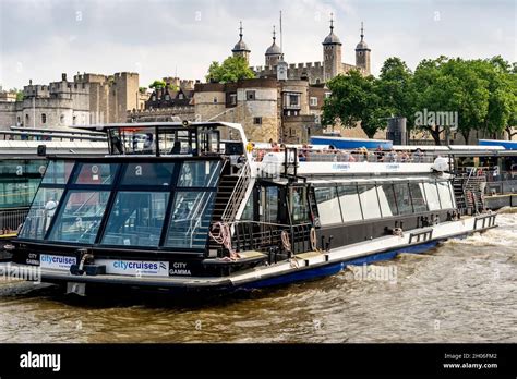 A City Cruises River Tour Boat With The Tower Of London In The Backround, London, UK Stock Photo ...