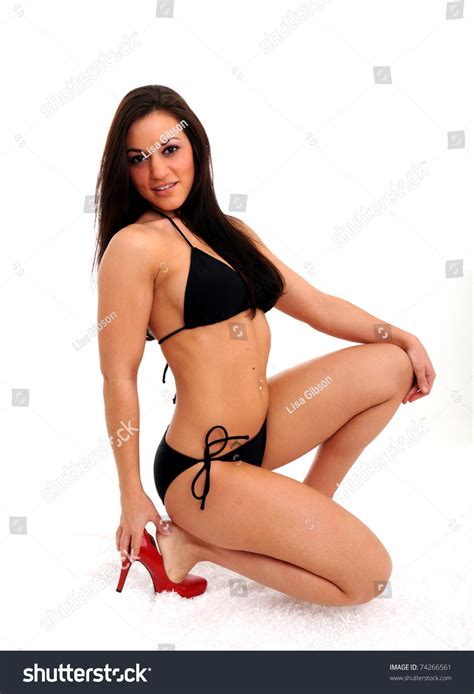 Beautiful Woman Black Bikini Squatting Red Stock Photo