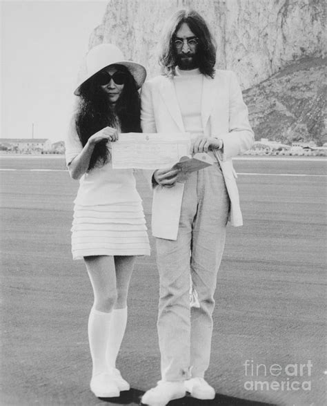 John Lennon And Yoko Ono Holding By Bettmann