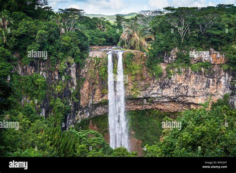 View at Chamarel waterfall water falling from the cliff surrounded by a