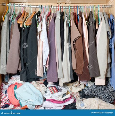 Pile Of Messy Clothes In Closet. Untidy Cluttered Woman Wardrobe ...