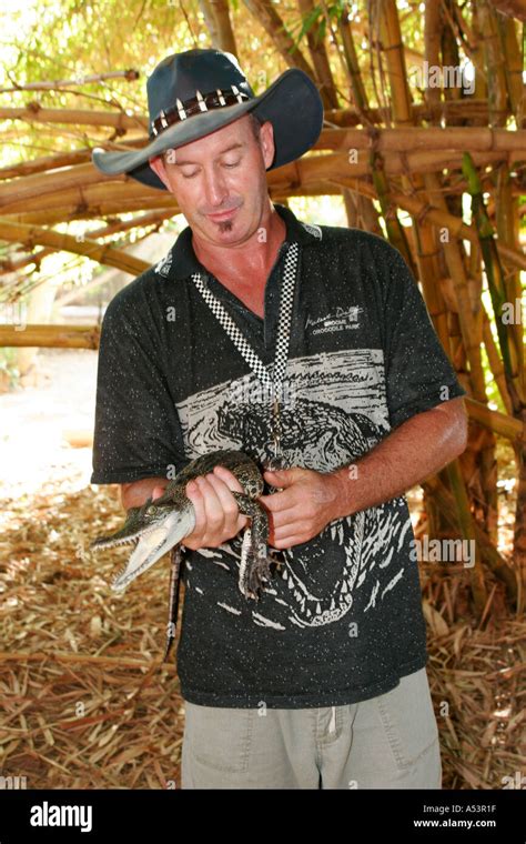 Handler With Small Crocodile At The Malcolm Douglas Broome Crocodile