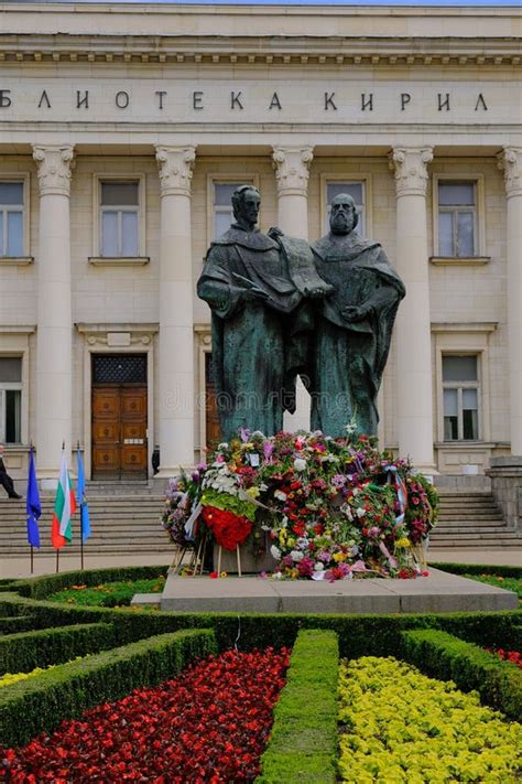People Offering Flowers To the Statue of Saints Cyril and Methodius in