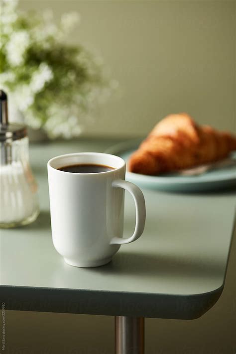 "Cup Of Black Coffee On Kitchen Table." by Stocksy Contributor "Martí ...