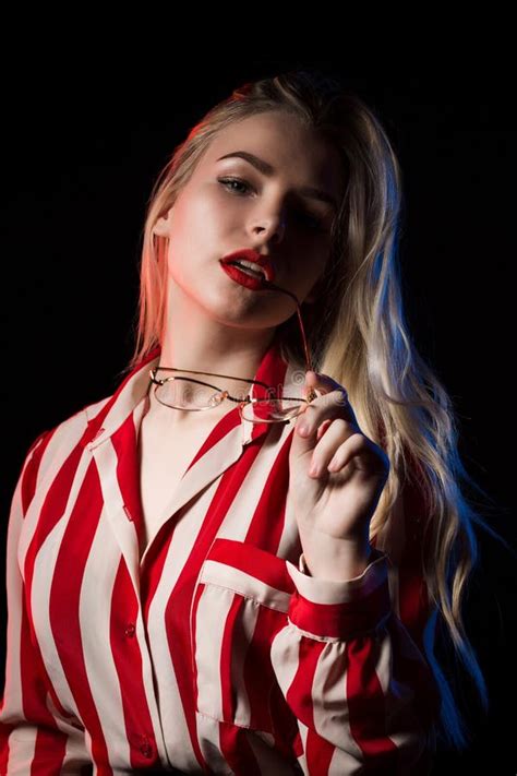 Sensual Blonde Woman In Glasses And Hat Wearing Shirt With Naked Shoulders Posing With