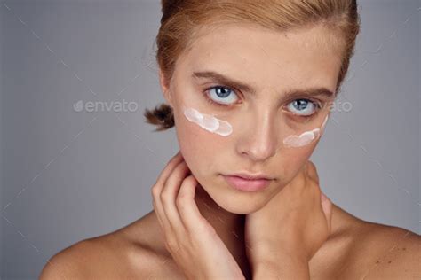 Woman Blonde With Bare Shoulders Clear Skin Face Naked Shoulders Cream Spa Salon Gray Background
