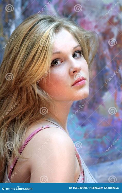 Portrait Of A Natural Blonde Teen Girl On A Colorful Background Stock