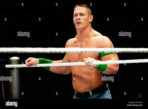 Us Wrestler John Cena Holds On To The Ropes Of The Wrestling Ring