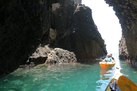 Santorini Sea Caves Kayak Tour With Snorkeling And Picnic Hellotickets