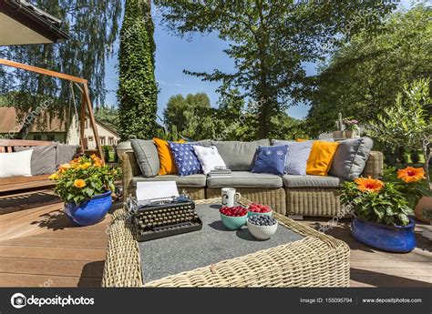 Terrace with garden furniture and typewriter Stock Photo by ...