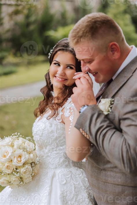 The Groom Kisses The Bride S Hand Wedding Photo Of A Couple In Love A