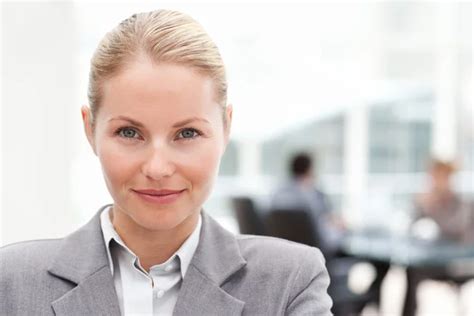 Assertive Businesswoman Looking At The Camera Sitting In Her Off Stock