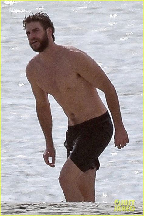 Liam Hemsworth Goes Shirtless On The Beach Where He Met Miley Cyrus