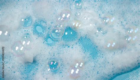 Soap Foam On The Water On A Blue Background Foam Texture As Background For Image Soap Bubbles