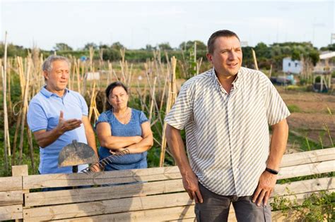 Man Quarreling With Mature Couple Neighours At Backyard Garden Stock Photo Image Of Friendship