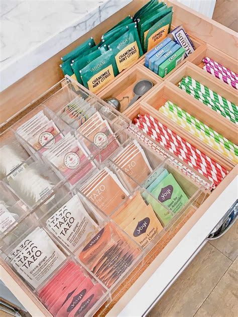 An Organized Drawer With Teas Coffee Bags And Other Items In The Drawers