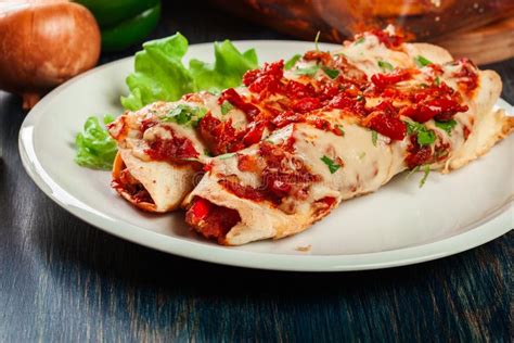 Traditional Mexican Enchiladas With Chicken Meat Spicy Tomato Sauce