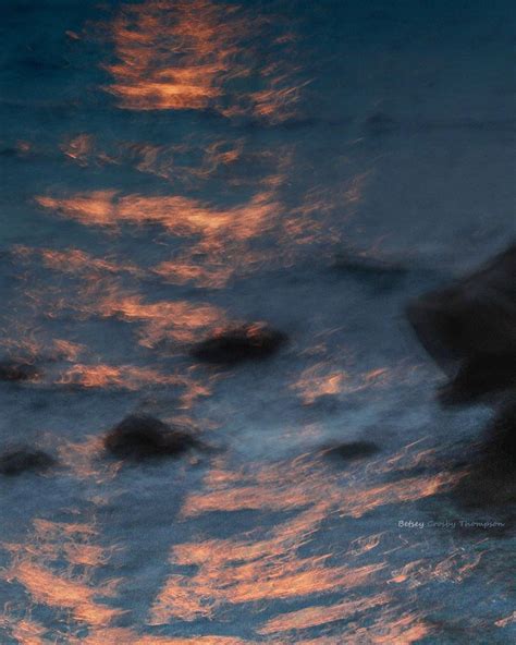 The Sky Reflected In The Water At Sunset