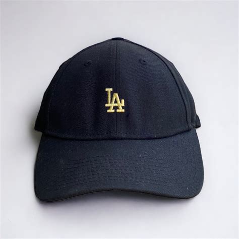 New Era 9Forty Black Hat Gold Embroidered logo, Men's Fashion, Watches ...