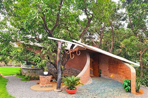 Organically-arranged brick walls form biophilic Asmalay house by ...