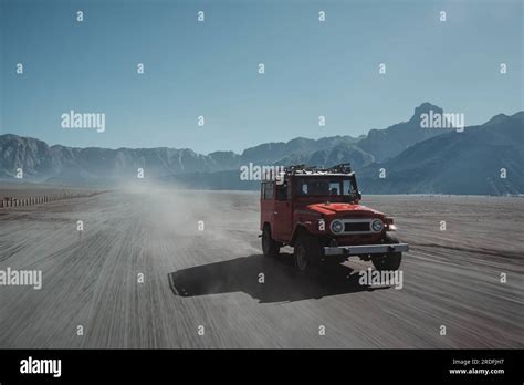 Unfocused With Motion Blur Shot Of A Red Off Road Vehicle Or Full Sized