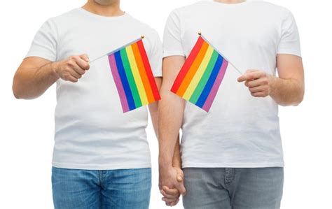 Premium Photo Male Couple With Gay Pride Flags Holding Hands