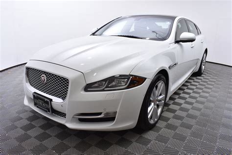 Pre Owned Jaguar Xj Dr Sedan Xjl Portfolio Awd Sedan In Golden