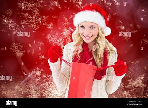 Composite Image Of Happy Festive Blonde With Shopping Bag Stock Photo Alamy